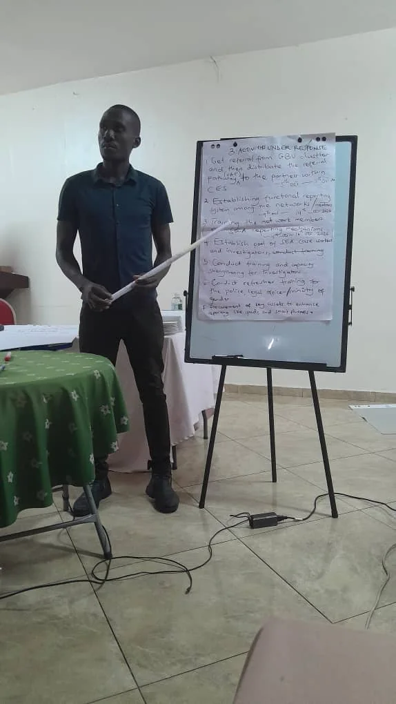A facilitator presents planned SEA response activities on a flipchart during the workshop.